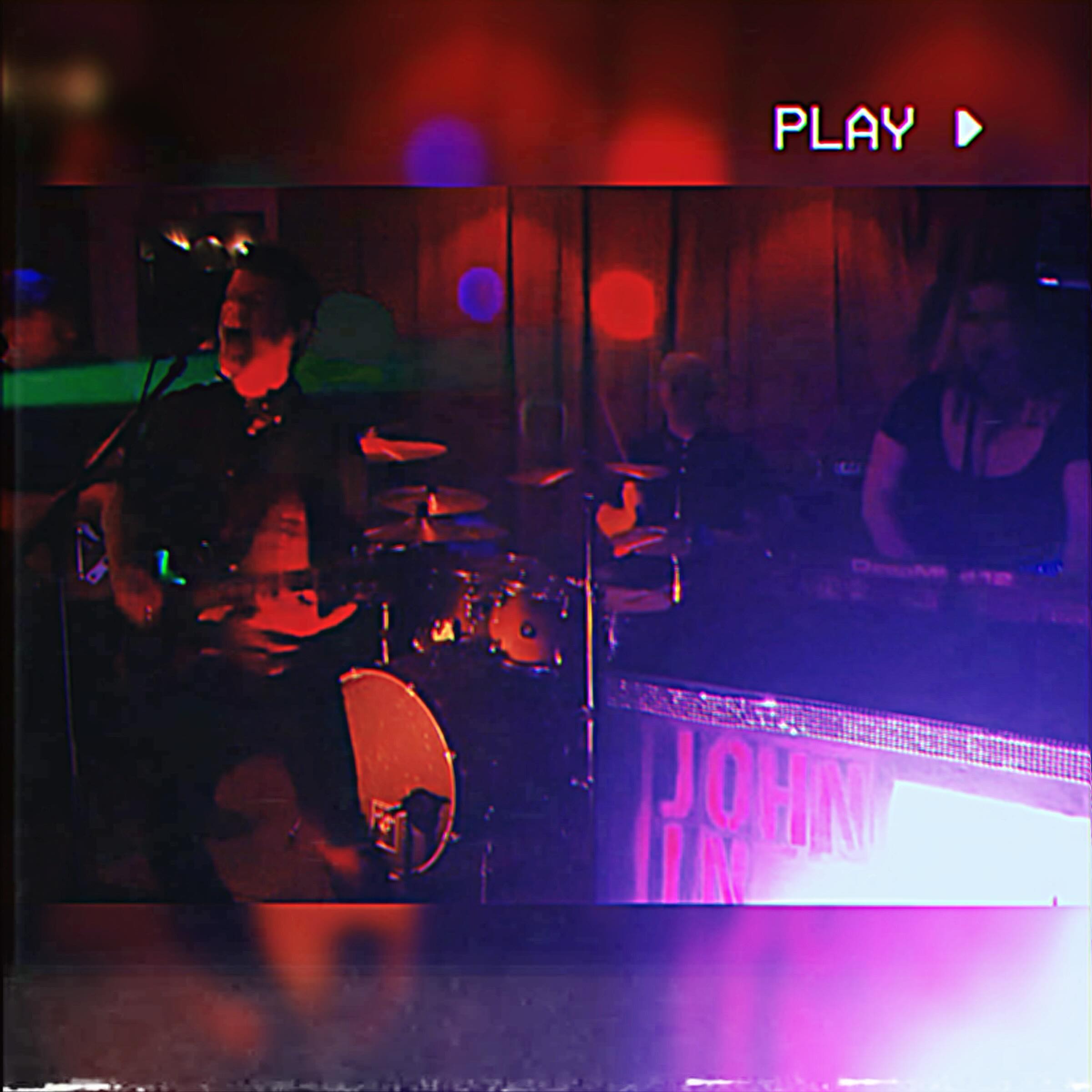 John in a Strangeland performing live